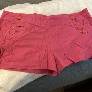Hot pink shorts.